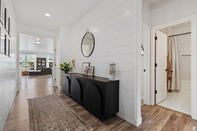 1002 South Yarrow Drive Mapleton, UT 84664 - Photo 6 of 39 White shiplap accent wall featuring a built-in black console cabinet