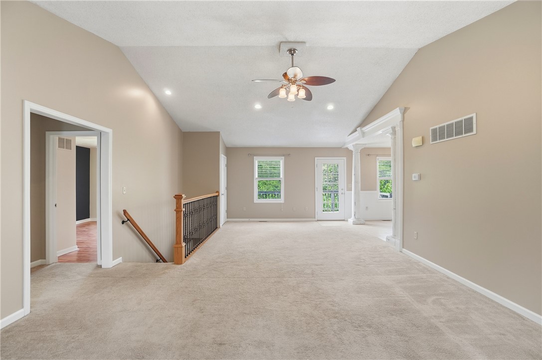 1208 Jarva Lane Springboro, OH 45066 - Photo 14 of 75 This airy space features vaulted ceilings and carpeted floors, perfect for a cozy atmosphere.