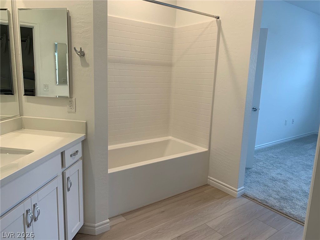 2555 Hampton Road, Unit 7109 Henderson, NV 89052 - Photo 28 of 34 A well-appointed bathroom with light wood flooring and a classic tub and shower combination.