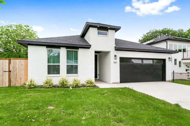 a front view of a house with yard