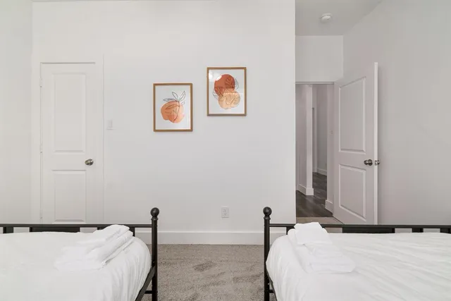 a bedroom with a bed and couch