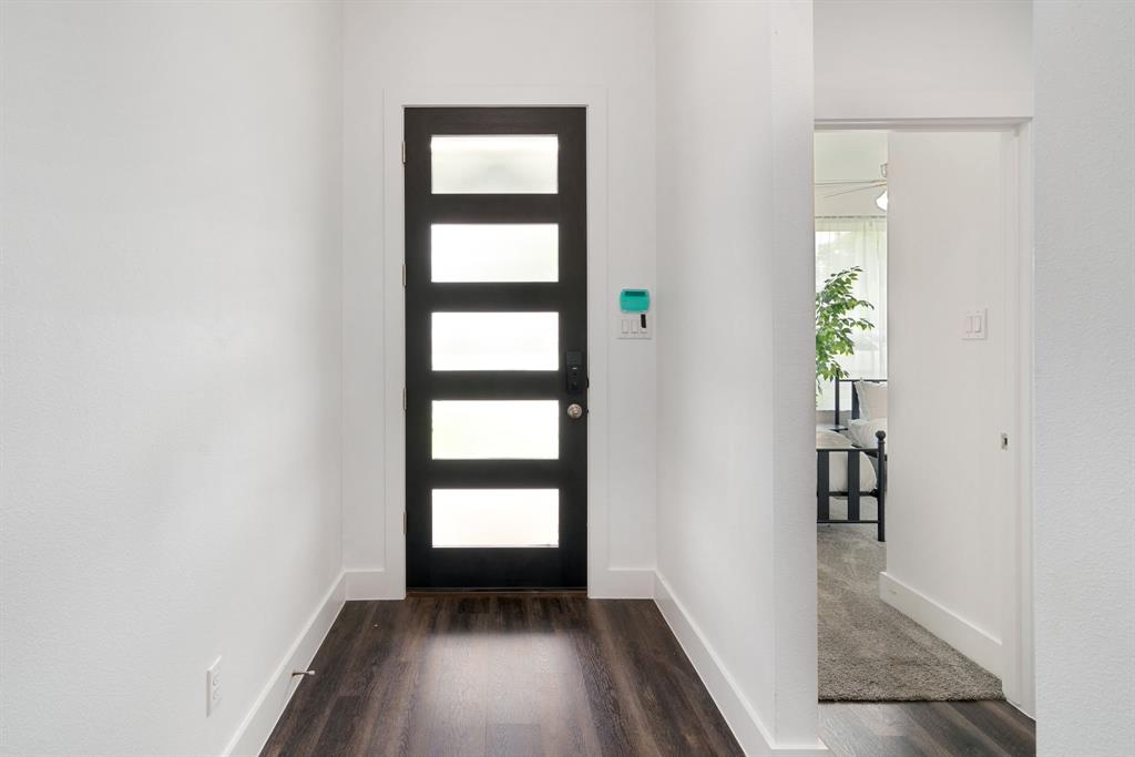 519 High Street Dallas, TX 75203 - Photo 3 of 38 wooden floor in an empty room with a window