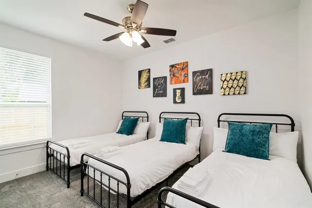 a bedroom with a bed and a table