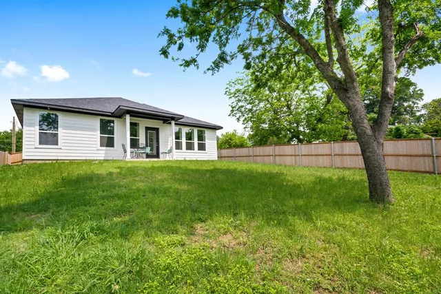a house view with a garden space