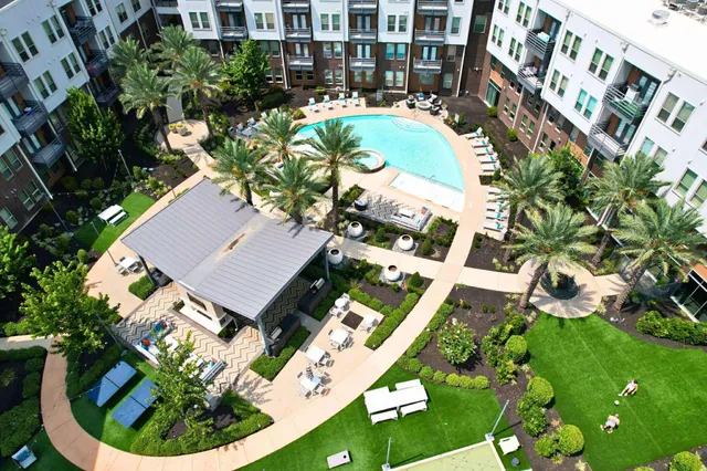 an aerial view of multiple houses with yard