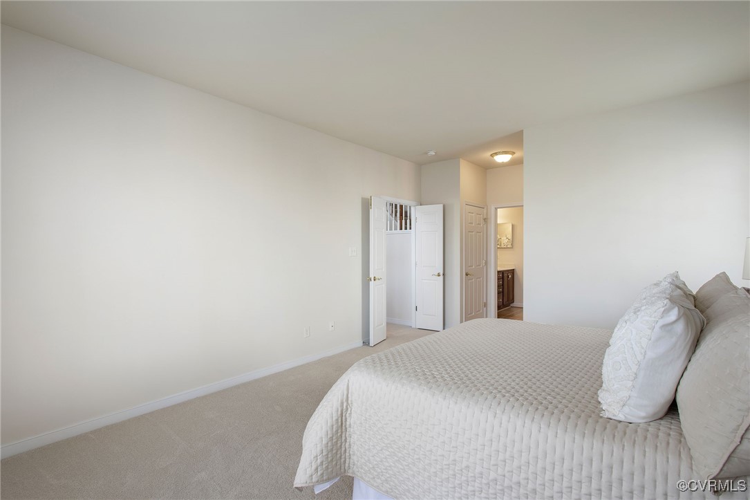 3025 Markfield Drive Midlothian, VA 23113 - Photo 26 of 41 a bedroom with a bed and a night stand