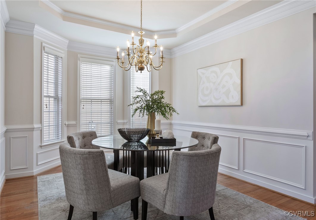 3025 Markfield Drive Midlothian, VA 23113 - Photo 10 of 41 a dining room with furniture potted plants and wooden floor