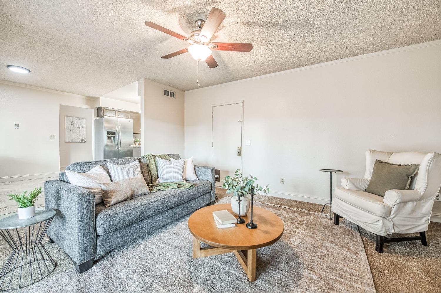 2866 Caesar Avenue Clovis, CA 93612 - Photo 19 of 45 a living room with furniture and a potted plant