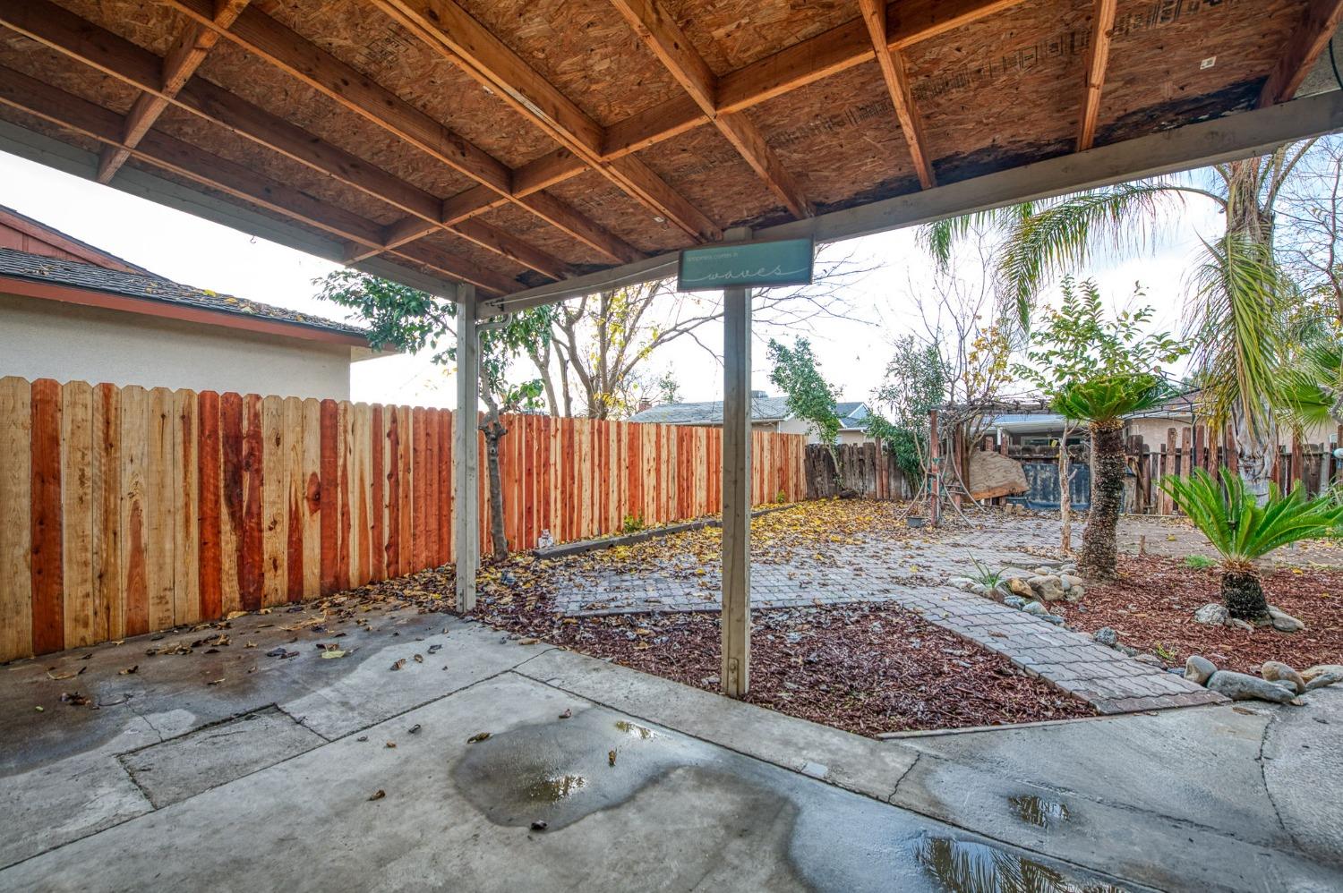 2866 Caesar Avenue Clovis, CA 93612 - Photo 28 of 45 a view of a backyard with table and chairs
