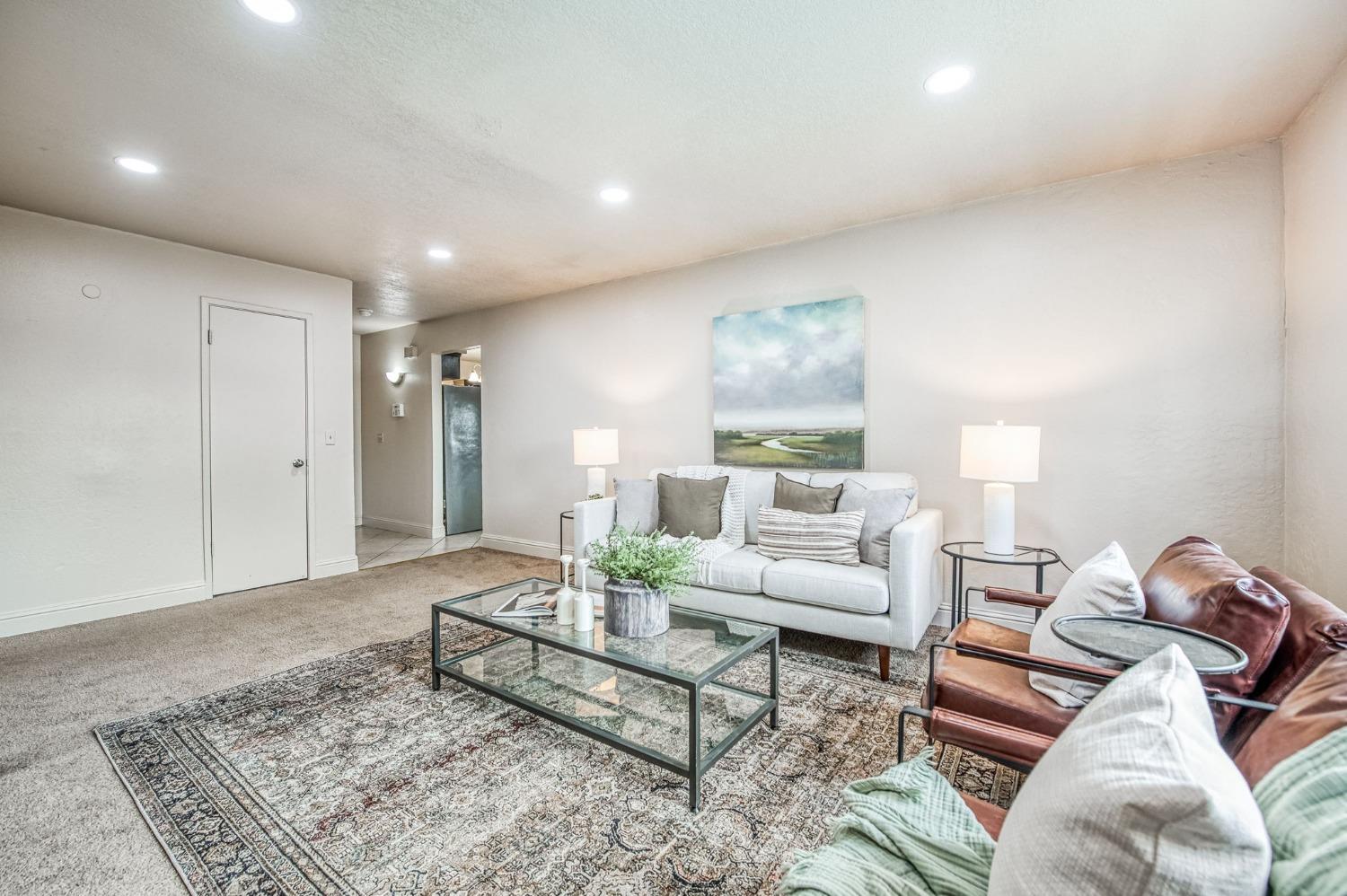 2866 Caesar Avenue Clovis, CA 93612 - Photo 7 of 45 a living room with furniture and a rug