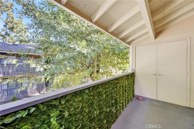 a view of balcony with wooden floor