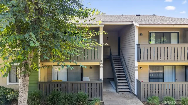 a view of a house with a small yard