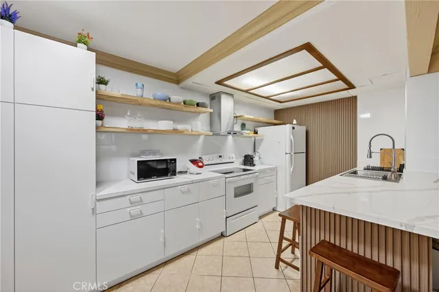 a kitchen with appliances cabinets and a sink