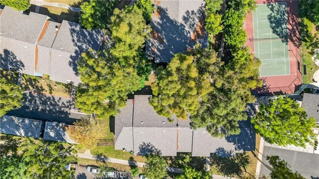 an aerial view of a house with a yard and garden