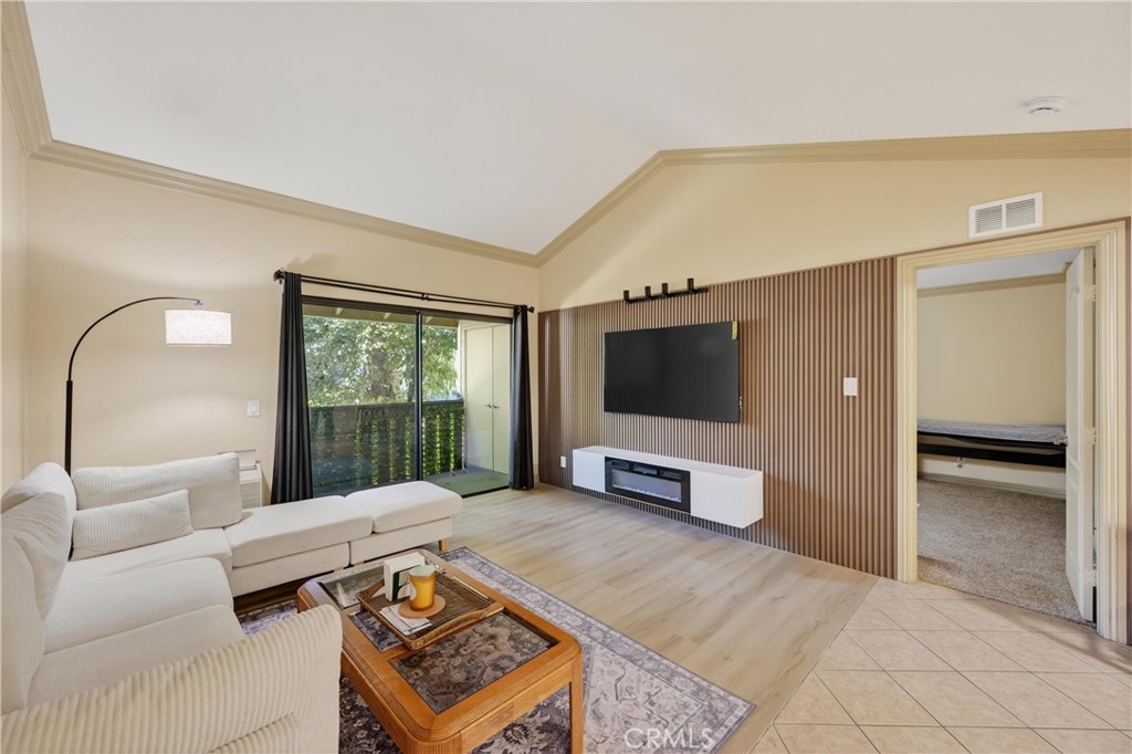 3535 Banbury Drive, Unit 14 Riverside, CA 92505 - Photo 3 of 26 a living room with furniture and a flat screen tv