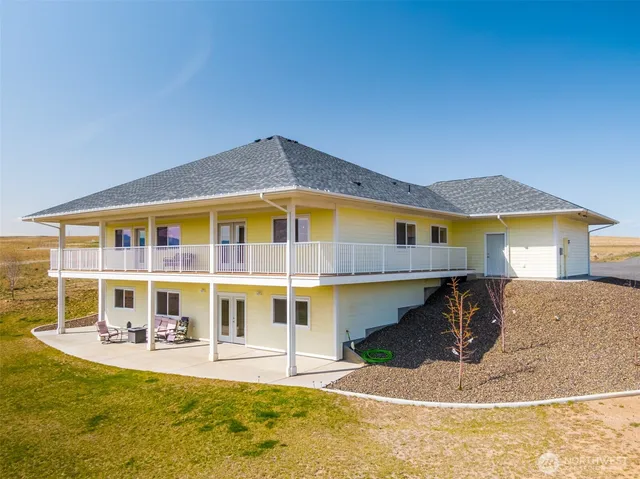 a front view of house with outdoor seating