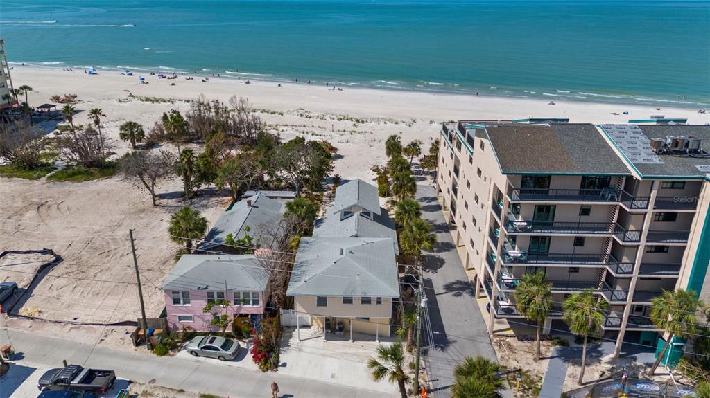 13062 Gulf Boulevard Madeira Beach, FL 33708 - Photo 8 of 72 an aerial view of multiple house
