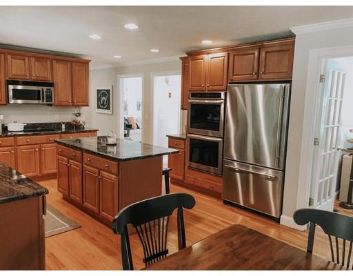 265 Sargent Road Boxborough, MA 01719 - Photo 2 of 15 a kitchen with stainless steel appliances granite countertop a refrigerator stove microwave and sink