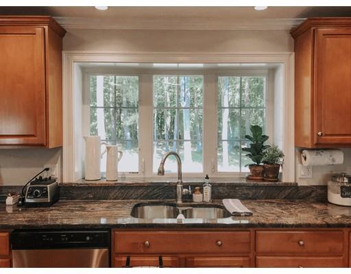 265 Sargent Road Boxborough, MA 01719 - Photo 3 of 15 a kitchen with granite countertop a sink and a window