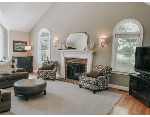 265 Sargent Road Boxborough, MA 01719 - Photo 7 of 15 a living room with furniture a flat screen tv and a fireplace