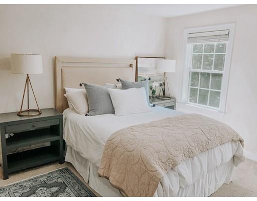265 Sargent Road Boxborough, MA 01719 - Photo 10 of 15 a bedroom with a bed and wooden floor