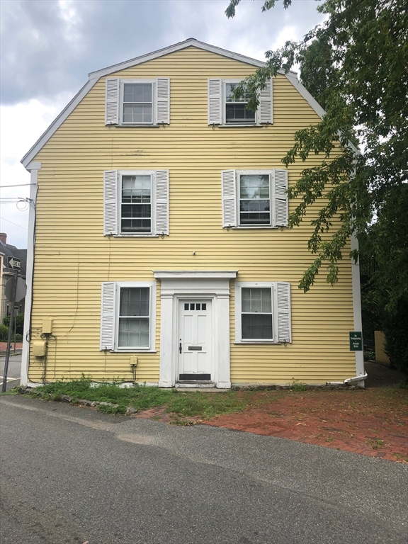 28 Darling Street, Unit 3 Marblehead, MA 01945 - Photo 7 of 8 a front view of a house with a road