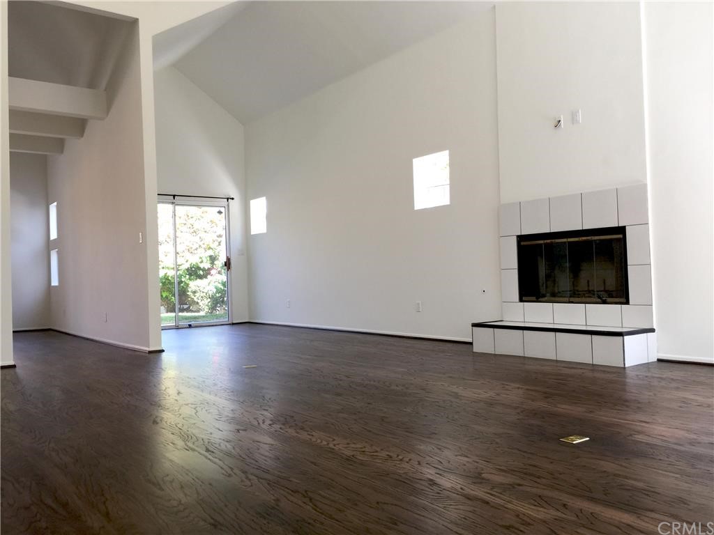 3401 Pine Avenue Manhattan Beach, CA 90266 - Photo 4 of 24 a view of an empty room with wooden floor and a window