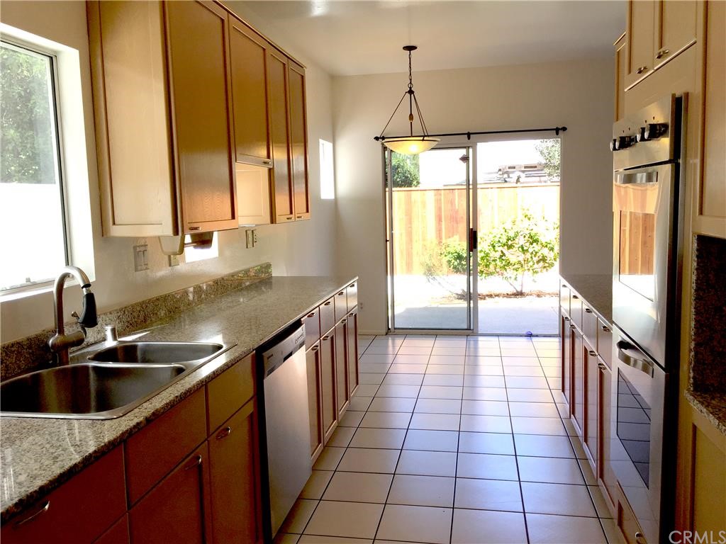3401 Pine Avenue Manhattan Beach, CA 90266 - Photo 6 of 24 a kitchen with stainless steel appliances a sink stove and a large window