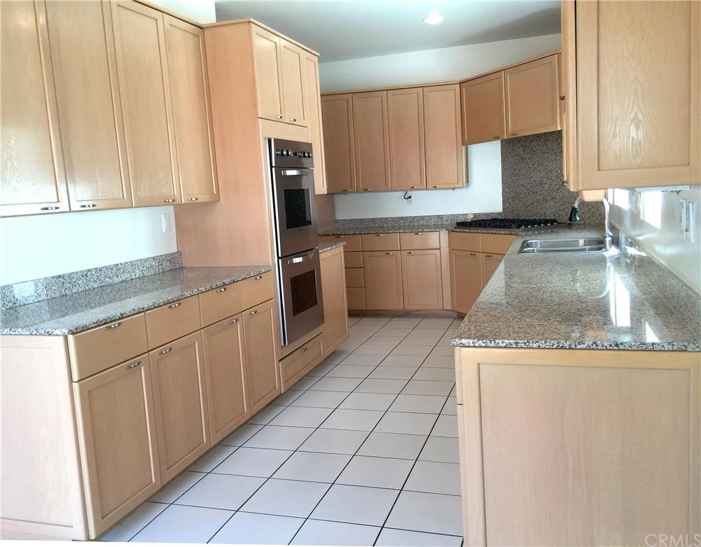 3401 Pine Avenue Manhattan Beach, CA 90266 - Photo 7 of 24 a kitchen with stainless steel appliances granite countertop a refrigerator sink and cabinets