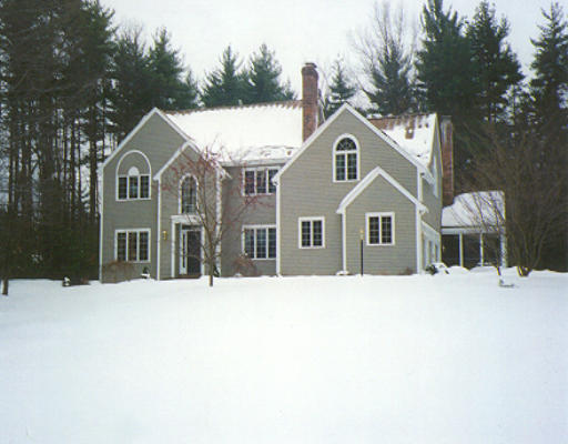 270 Robinson Road Boxborough, MA 01719 - Photo 1 of 1 a front view of a house with a yard covered in snow