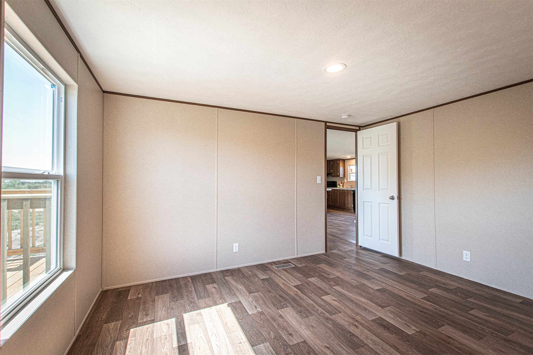 135 Spanish Oak Road Dale, TX 78616 - Photo 20 of 30 a view of empty room with wooden floor and entryway