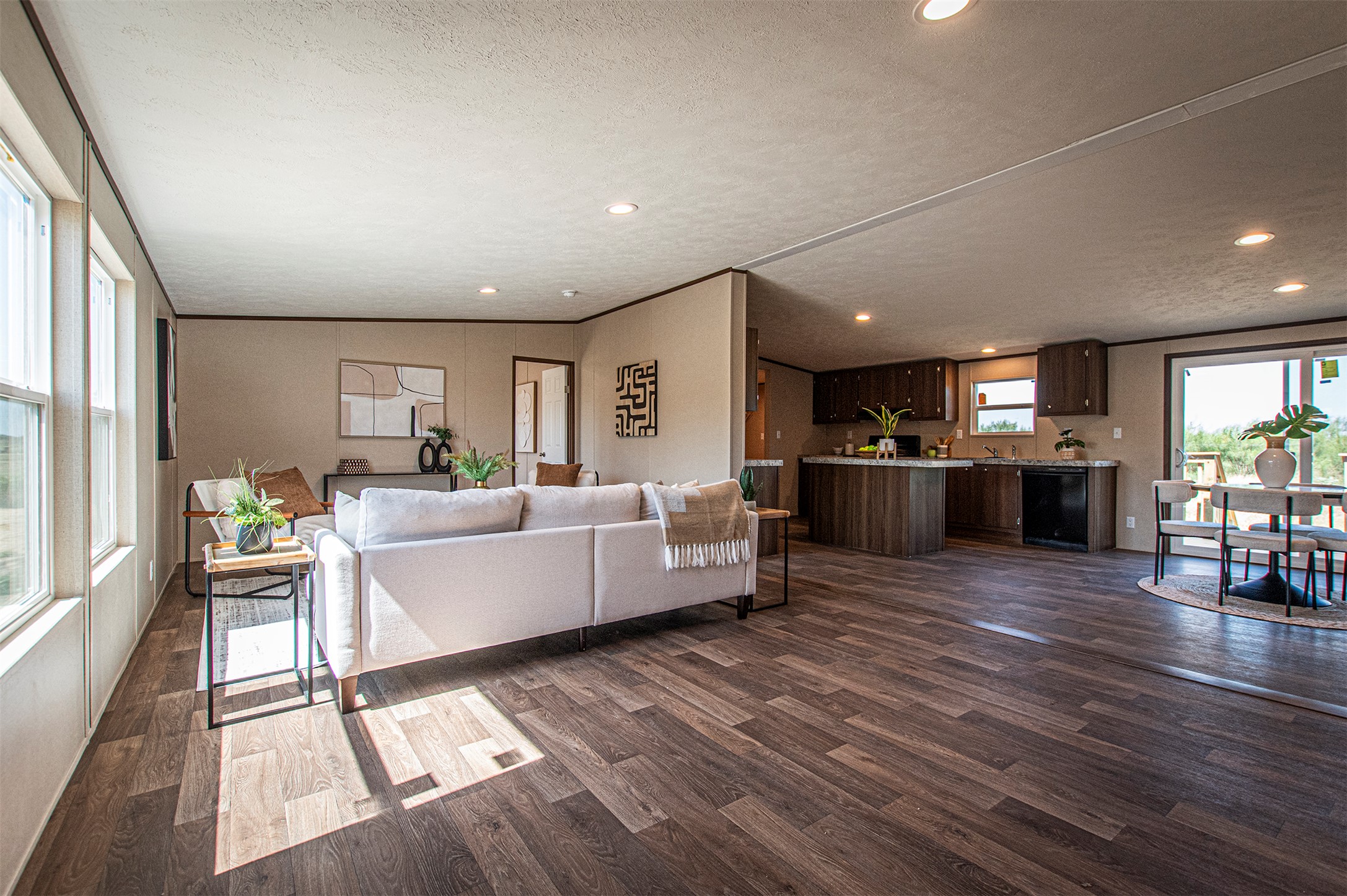 135 Spanish Oak Road Dale, TX 78616 - Photo 6 of 30 a large living room with stainless steel appliances granite countertop furniture wooden floor and a large window
