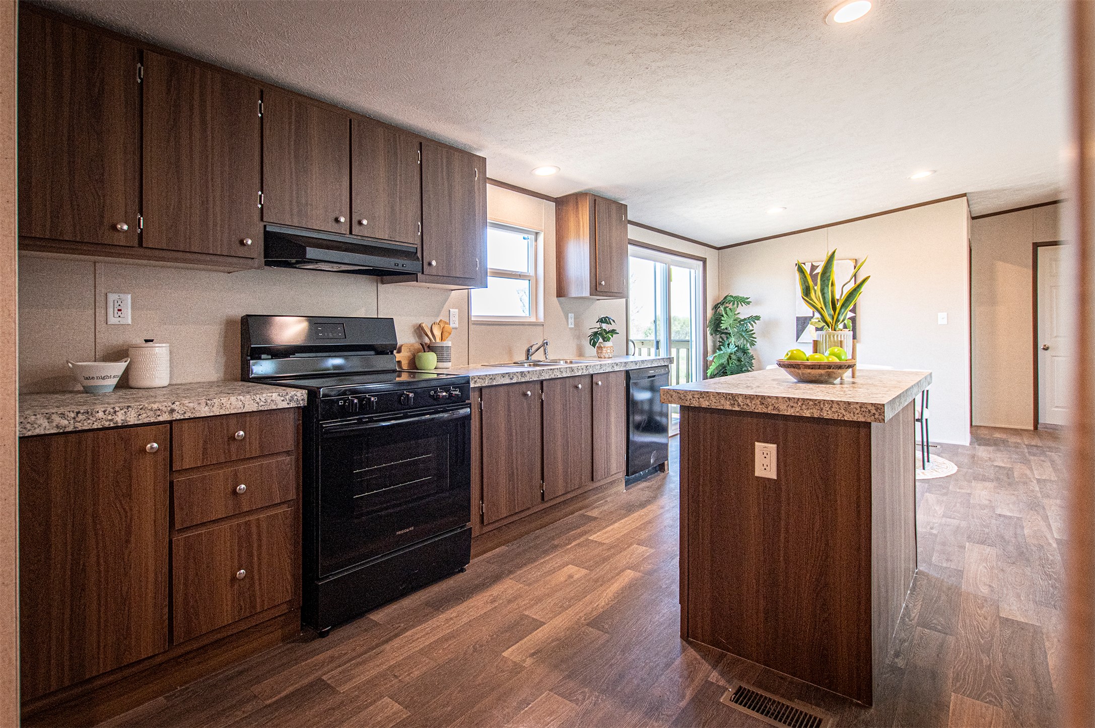 135 Spanish Oak Road Dale, TX 78616 - Photo 8 of 30 a kitchen with stainless steel appliances granite countertop a stove a sink dishwasher and a refrigerator
