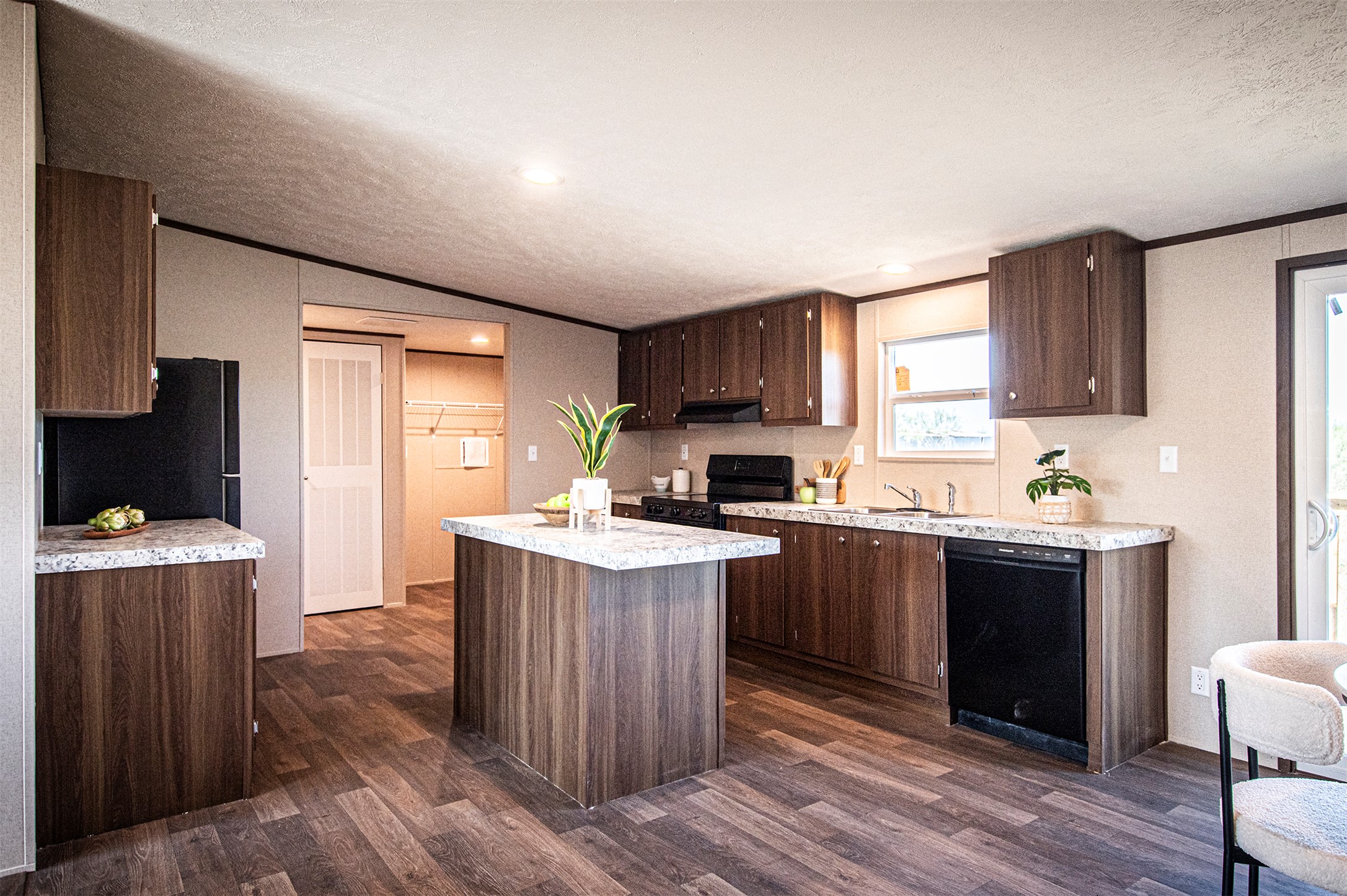 135 Spanish Oak Road Dale, TX 78616 - Photo 9 of 30 a kitchen with a stove top oven sink and cabinets