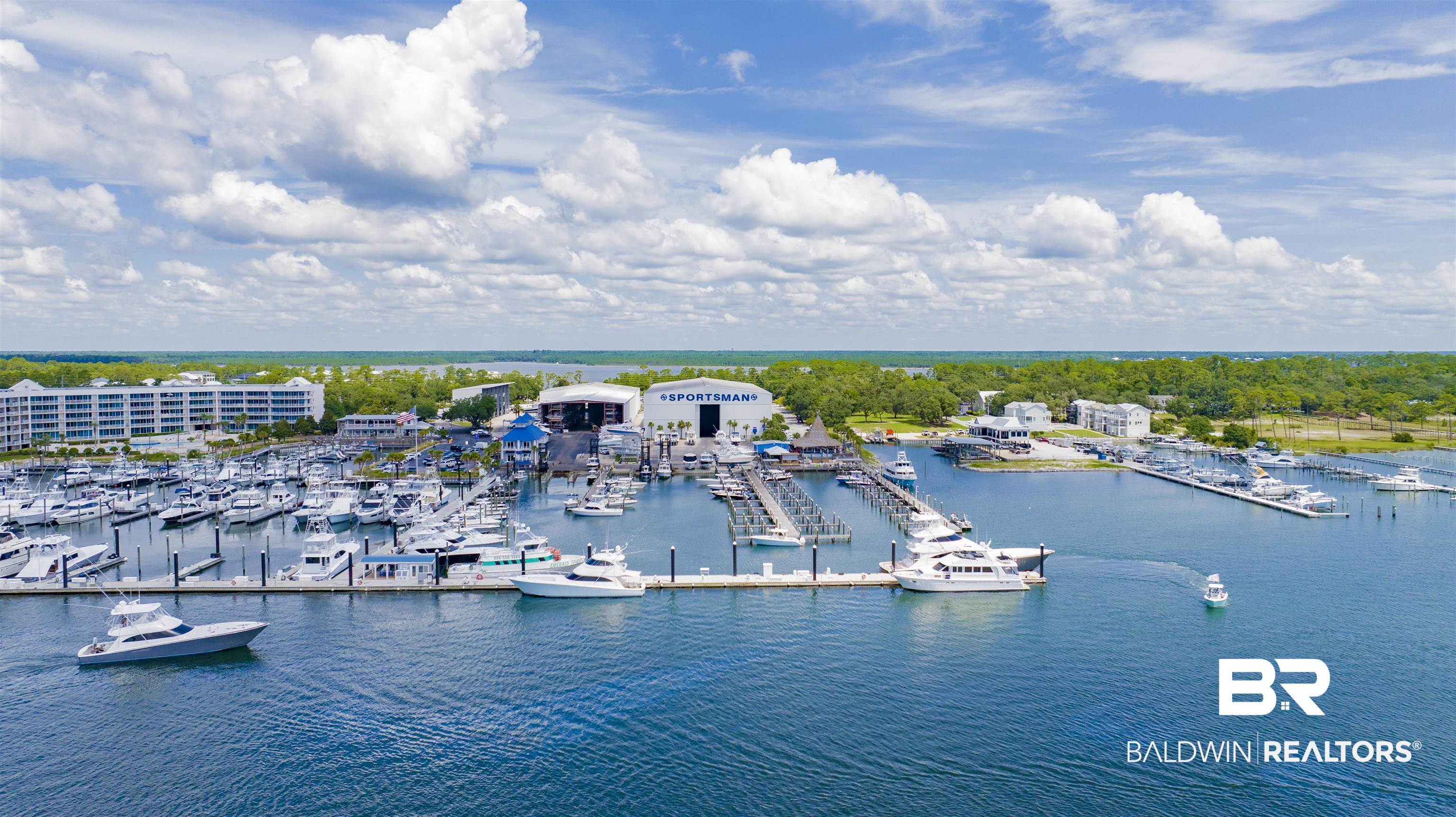 27980 Canal Road Orange Beach, AL 36561 - Photo 42 of 46 Bird's eye view of a marina and a large body of water
