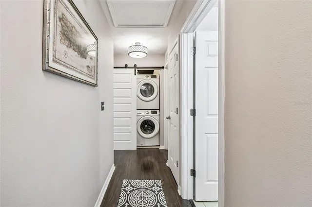 a view of a hallway with washer and dryer