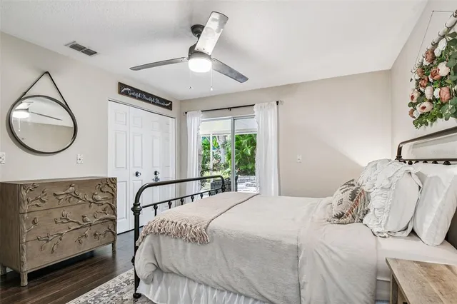 a bedroom with a bed and a mirror