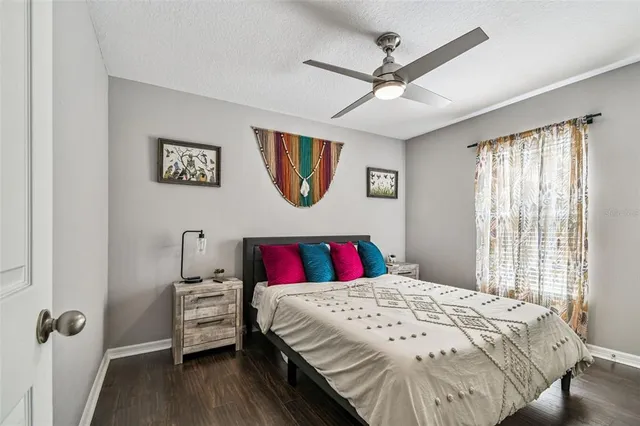 a bedroom with a bed and a table