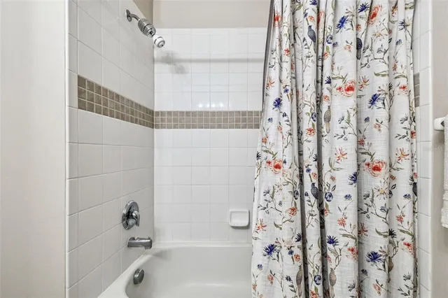 a bathroom with a shower curtain