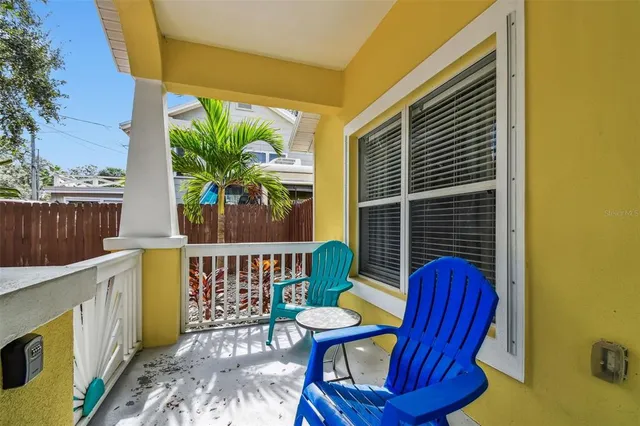 a view of balcony with furniture