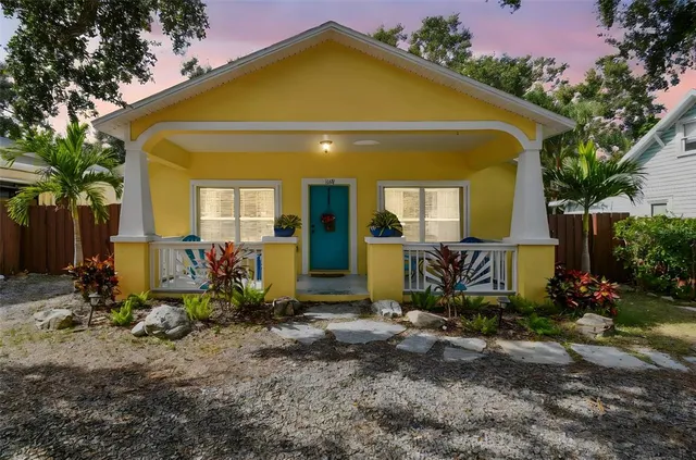 a view of front door and small yard