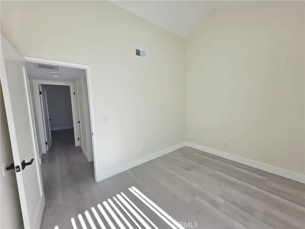 a view of a small space with wooden floor