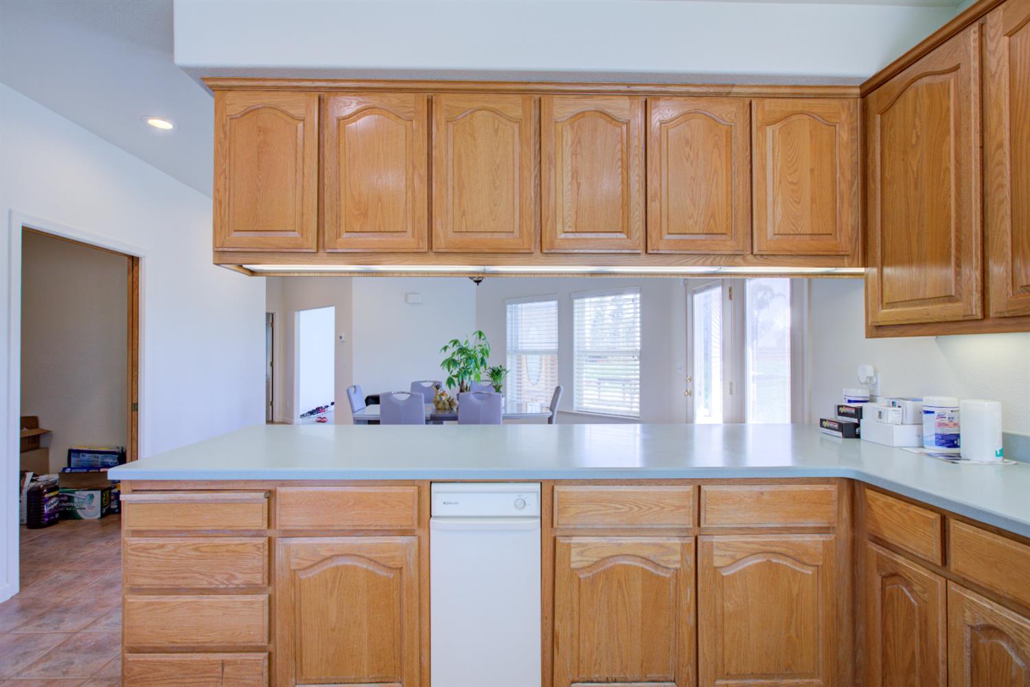9681 Wamble Road Oakdale, CA 95361 - Photo 13 of 50 a kitchen with stainless steel appliances granite countertop white cabinets and a refrigerator