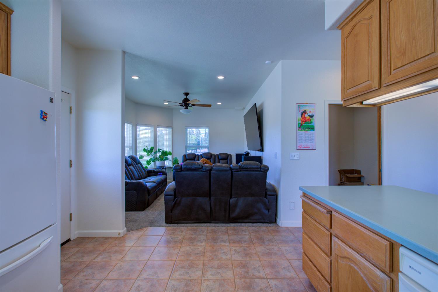 9681 Wamble Road Oakdale, CA 95361 - Photo 14 of 50 a view of kitchen with stainless steel appliances kitchen island granite countertop a refrigerator and a sink