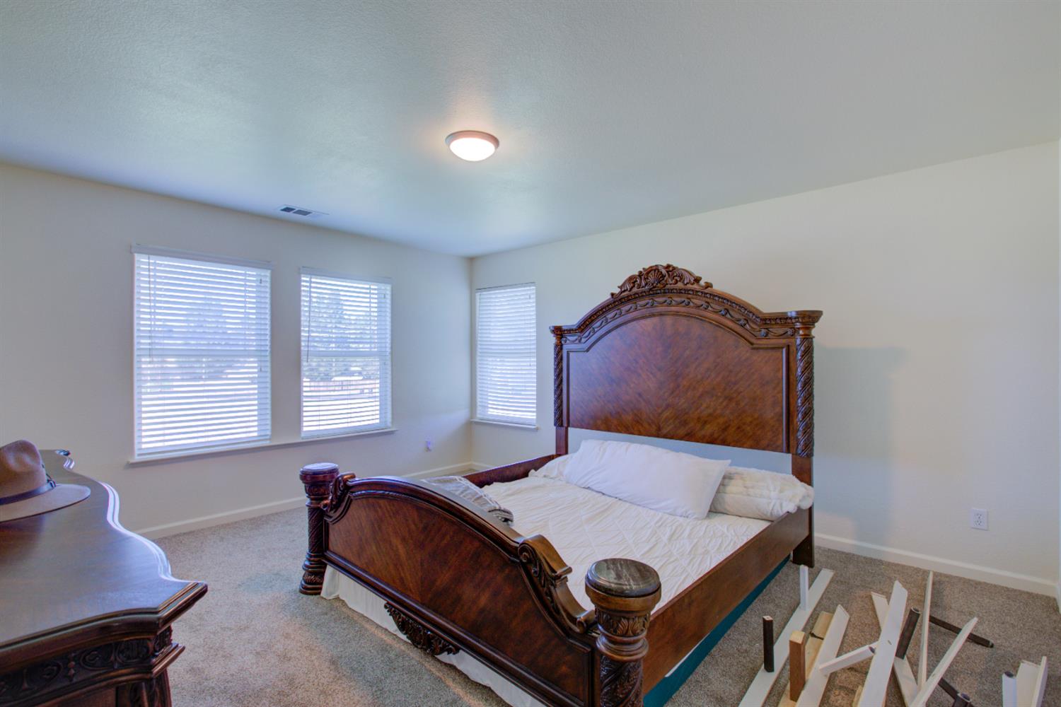 9681 Wamble Road Oakdale, CA 95361 - Photo 17 of 50 a bedroom with a bed and window