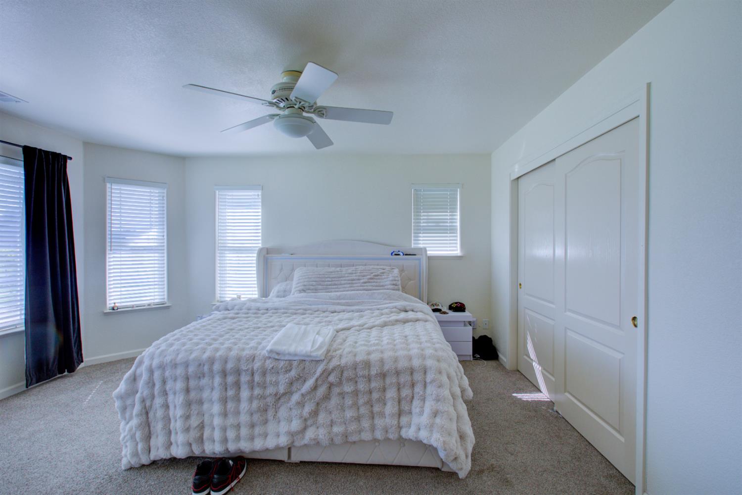 9681 Wamble Road Oakdale, CA 95361 - Photo 31 of 50 a bedroom with a bed and window