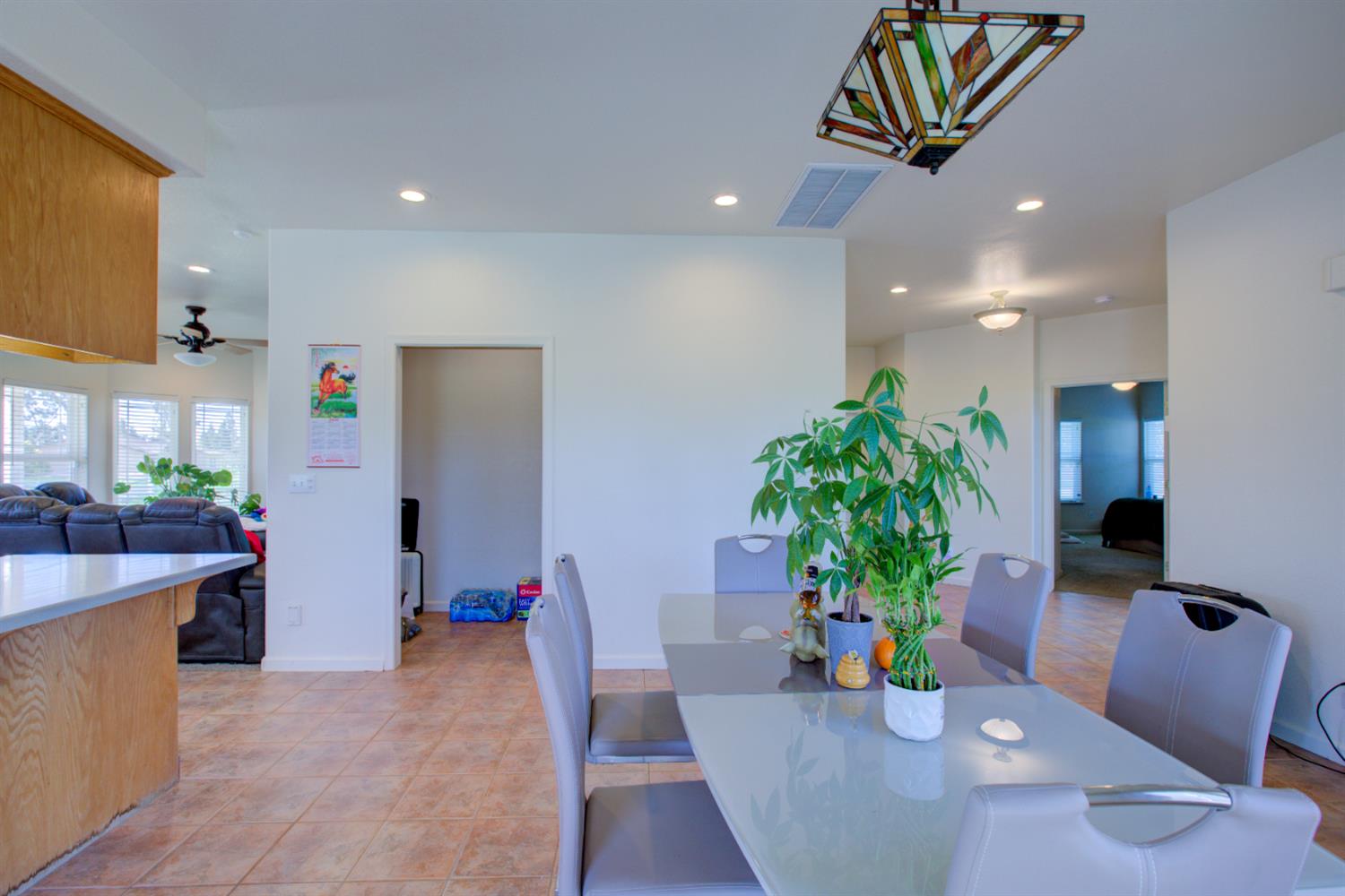 9681 Wamble Road Oakdale, CA 95361 - Photo 35 of 50 a dining room with furniture and potted plant