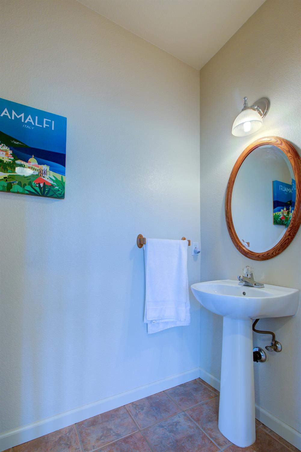 9681 Wamble Road Oakdale, CA 95361 - Photo 42 of 50 a bathroom with a sink mirror and vanity
