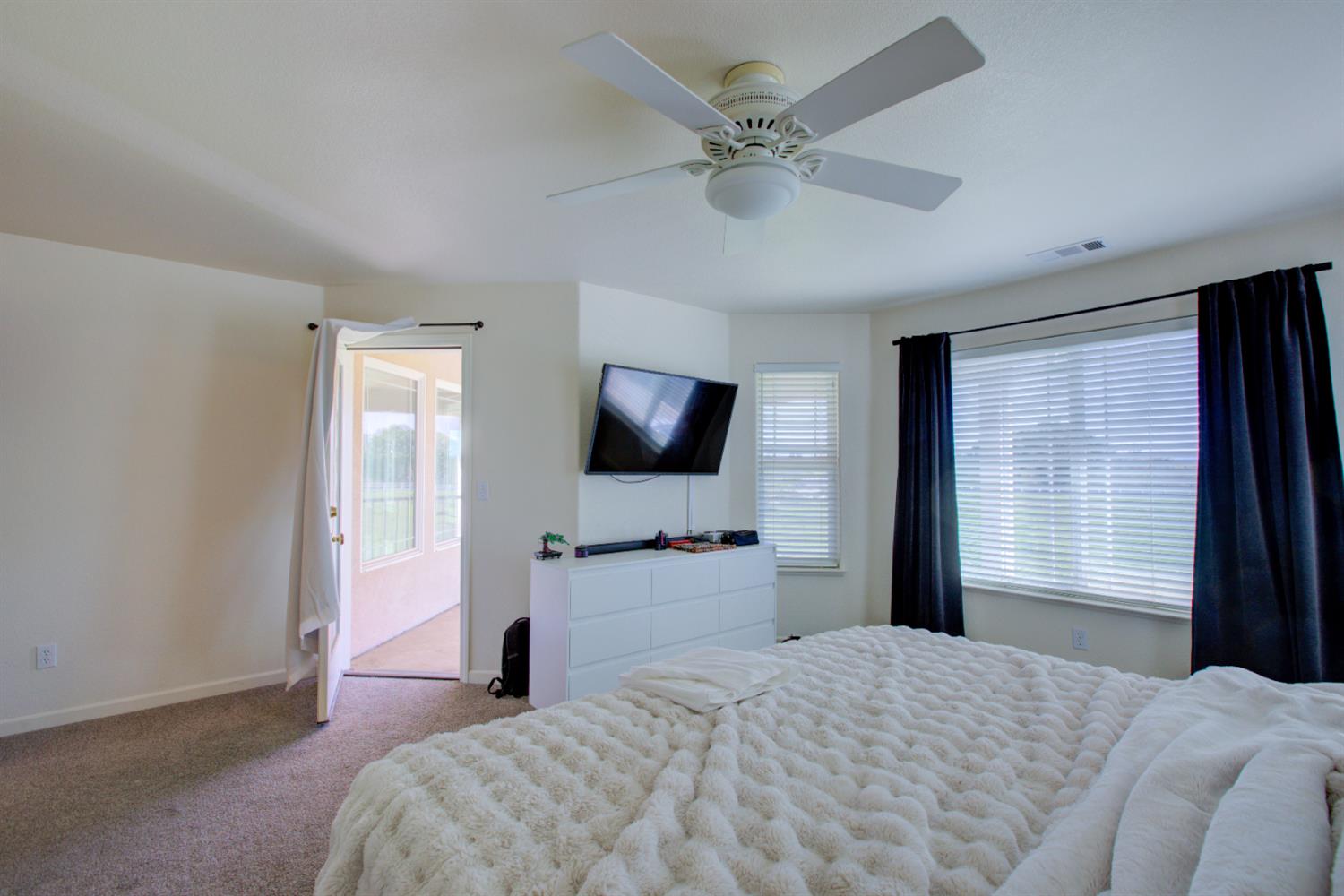 9681 Wamble Road Oakdale, CA 95361 - Photo 44 of 50 a bedroom with a bed and a flat screen tv