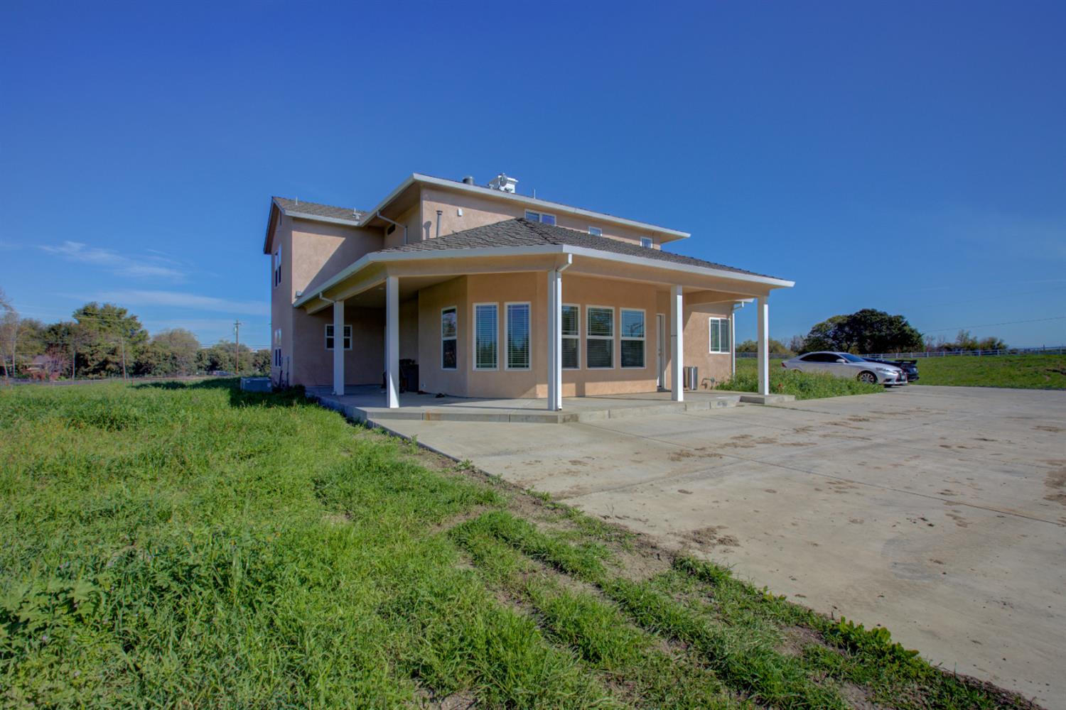 9681 Wamble Road Oakdale, CA 95361 - Photo 46 of 50 a view of a house with yard and porch